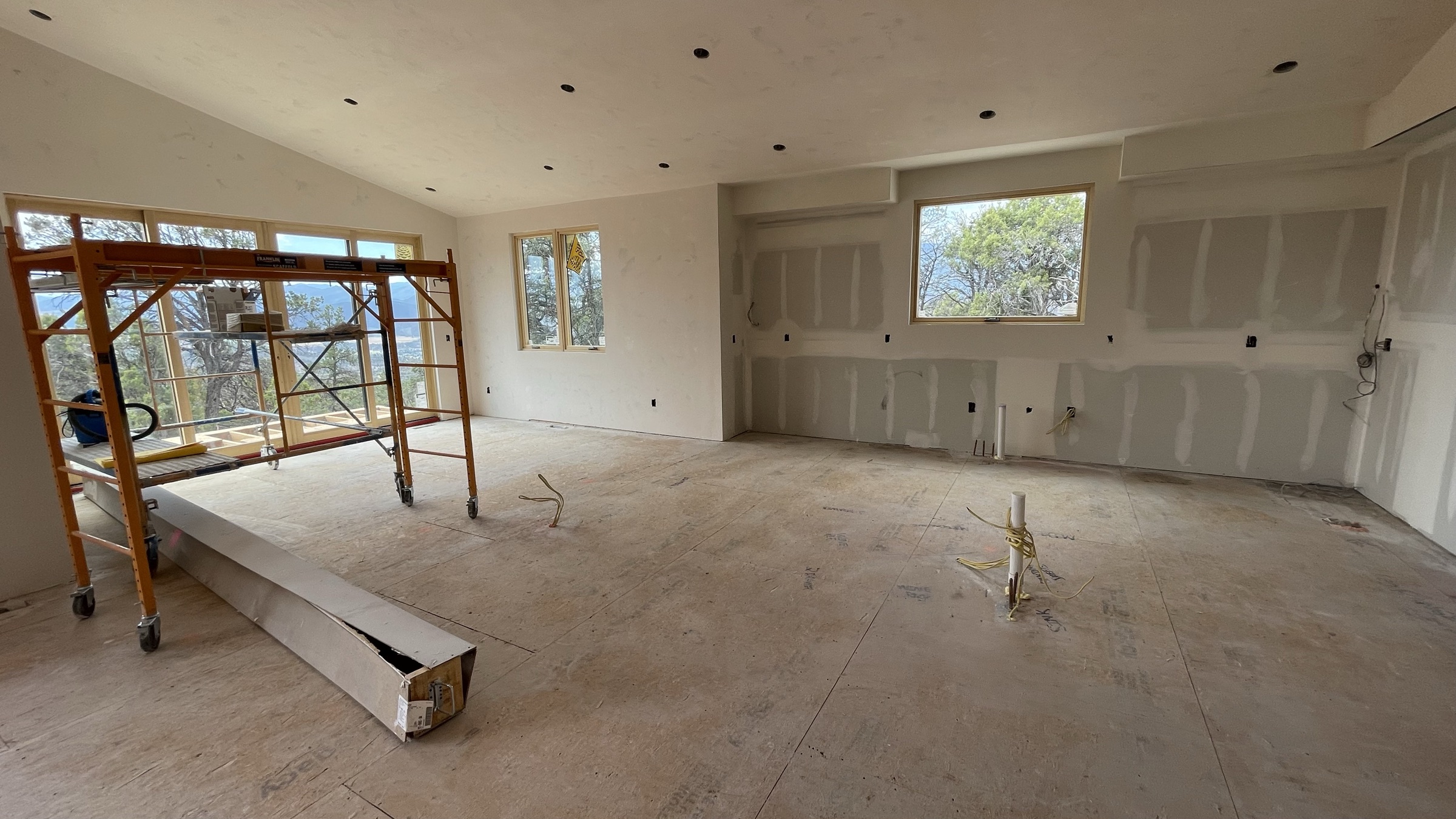Kitchen with drywall complete and view windows — July 26, 2026