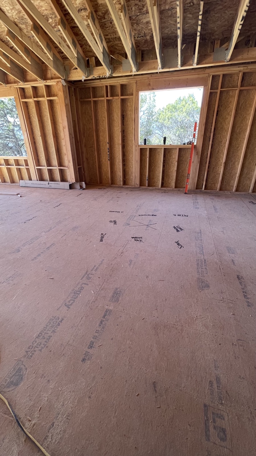 Interior framing with mountain views through windows
