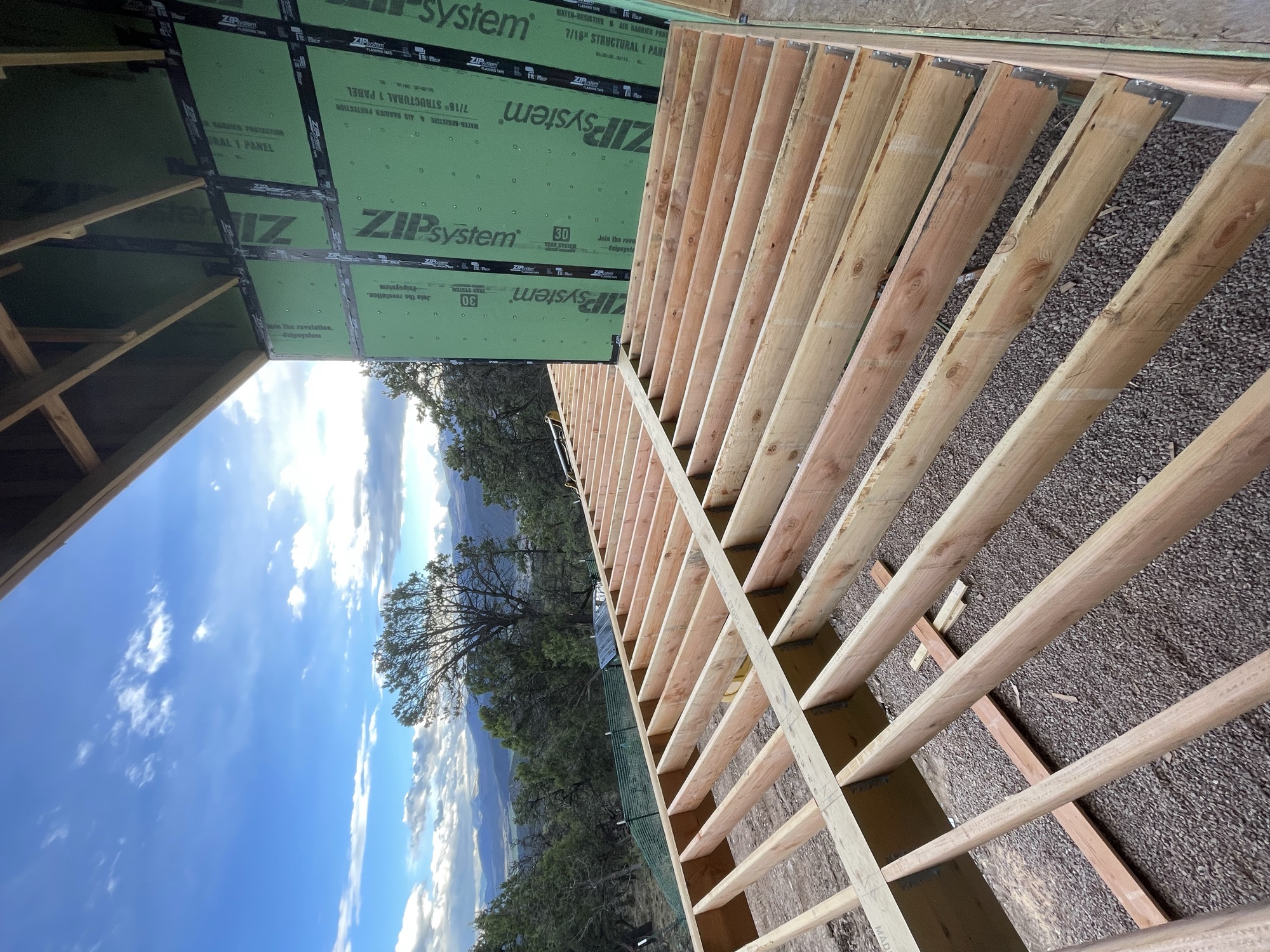 Exposed deck joists and deck framing going down over the lower level — April 2, 2026
