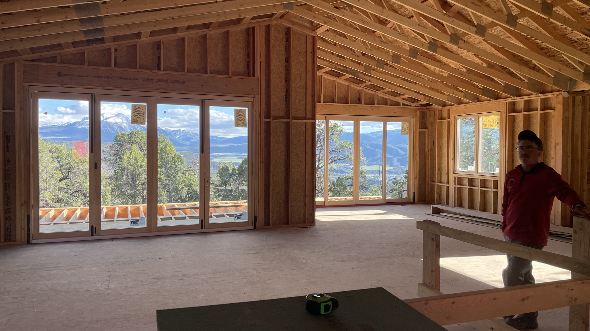 Great room cathedral ceiling with exposed trusses and dual window walls — April 15, 2026